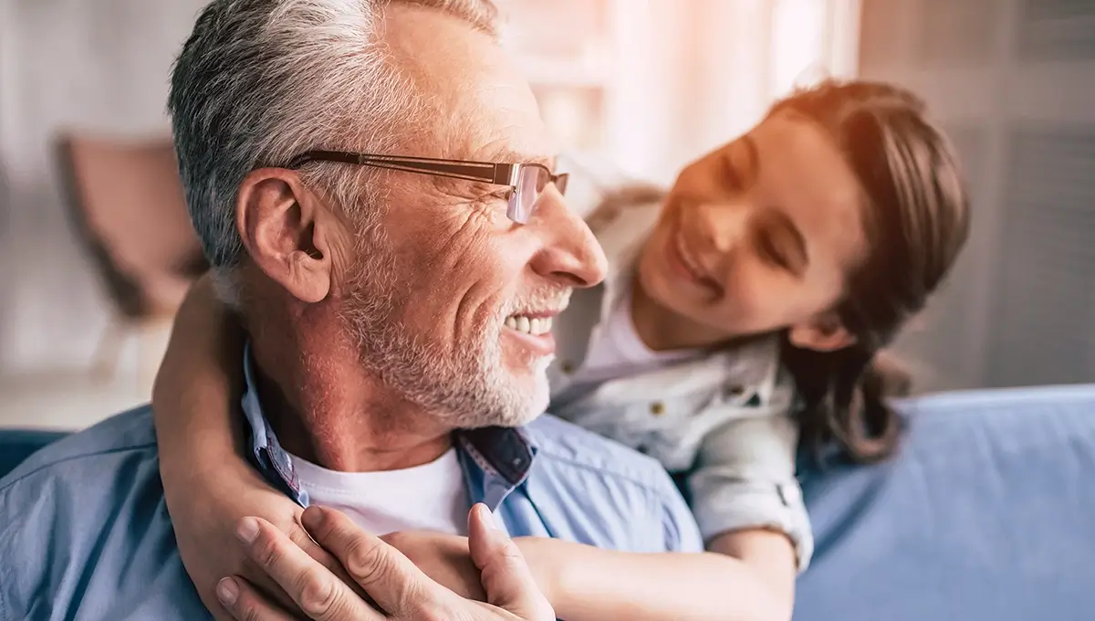 Father and daughter hugging and smiling